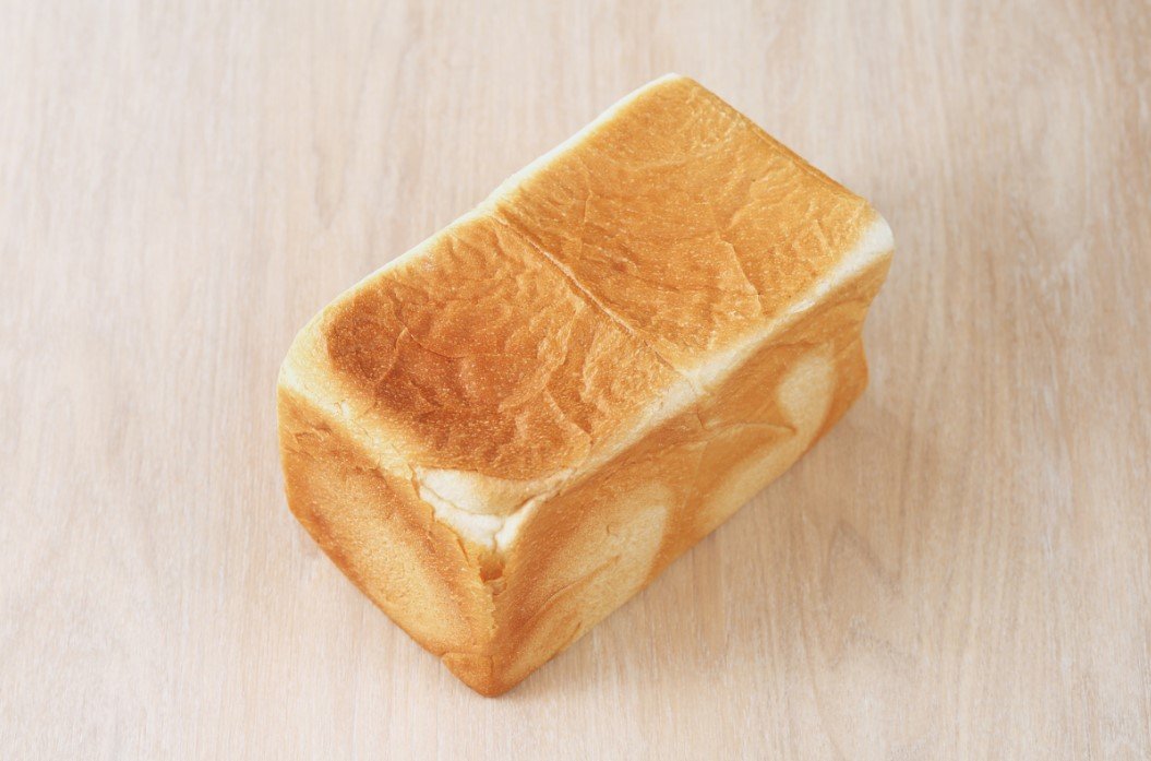 Sliced shokupan loaf on a wooden board
